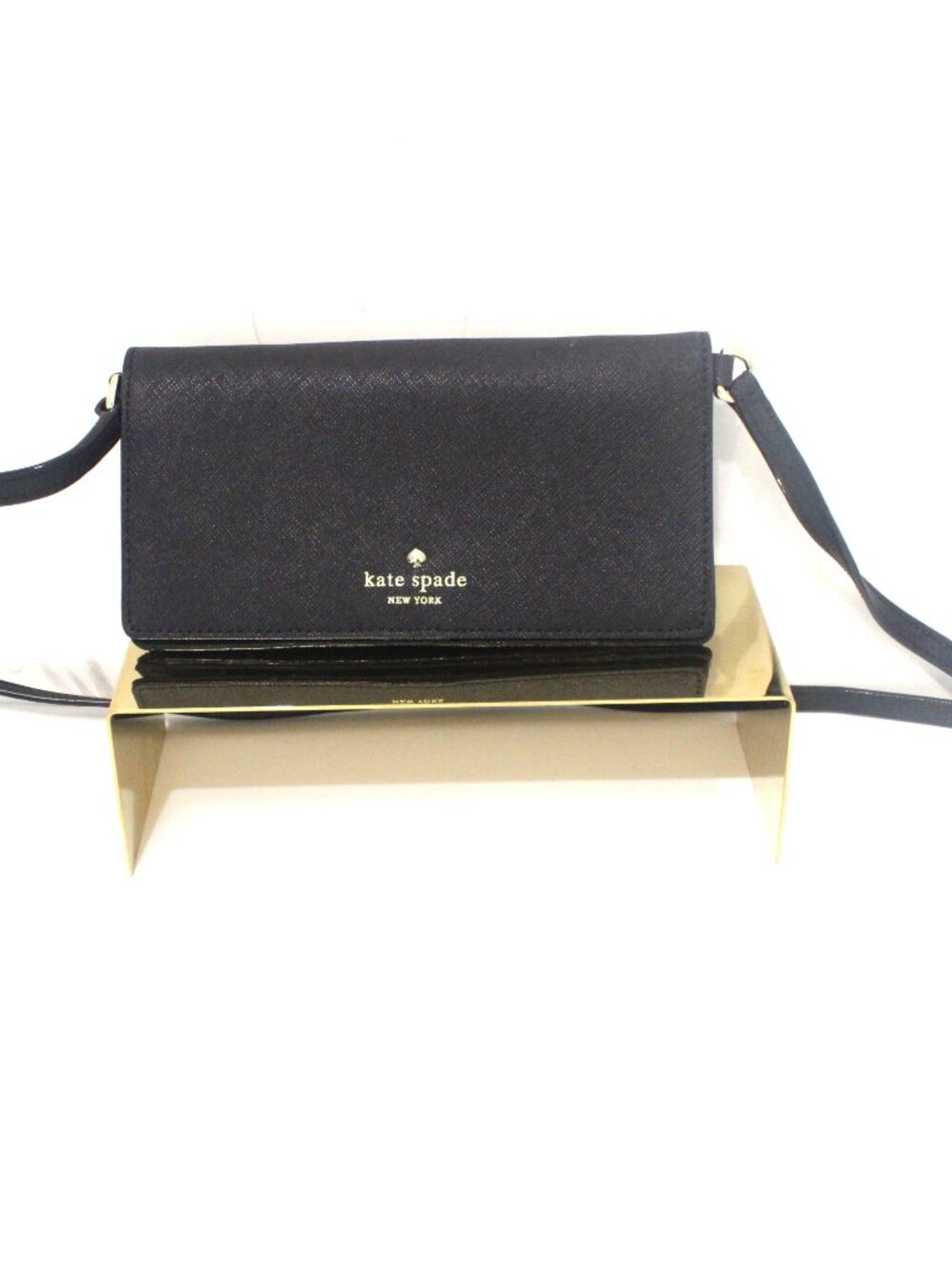 The Kate Spade Bifold Wallet/Crossbody in Black Saffiano Leather is a stylish an